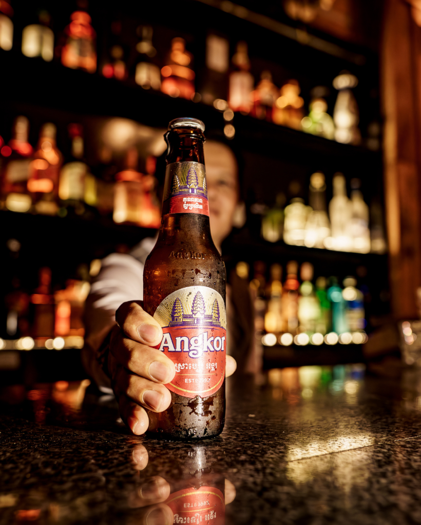 Cozy bar interior with warm lighting and seating area